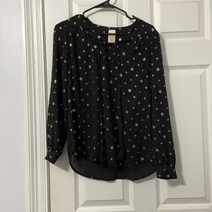 Black blouse with gold diamond accents